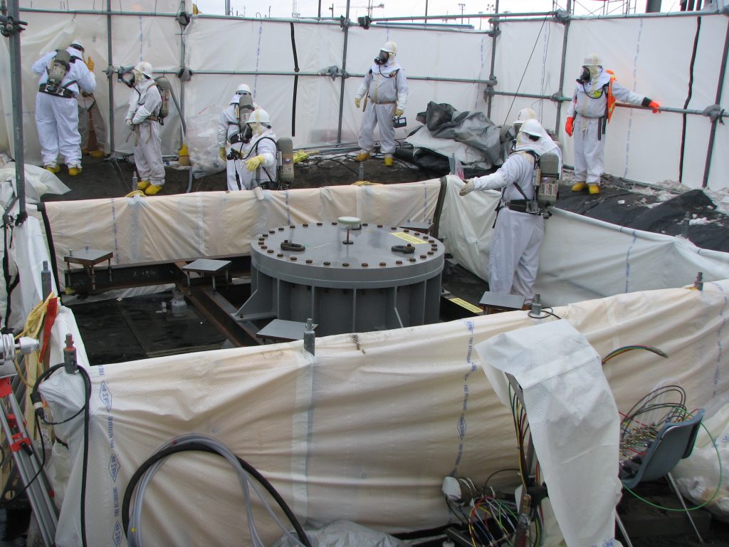 men in hazmat suits at a nuclear site