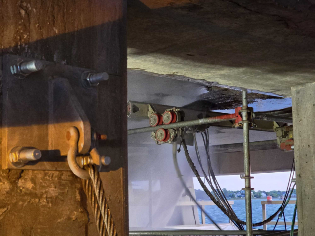 The ErgoGo removing concrete from the underside of a bridge deck.