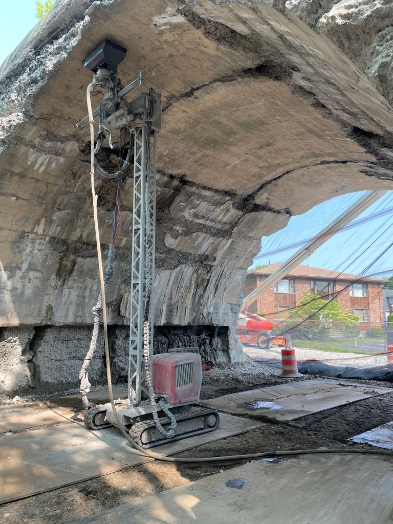 710V robot performing hydrodemolition on the Greenway walls.
