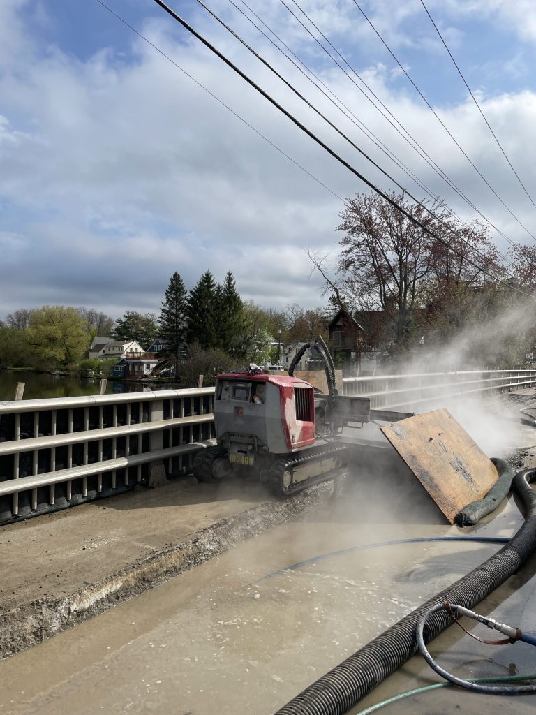 The robot performing hydrodemolition for bridge deck repair.
